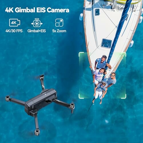 Drone capturing aerial view of a boat with people on it.